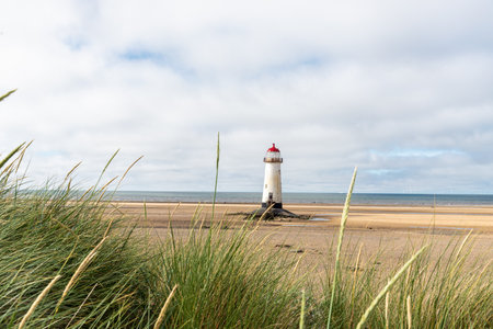 Beach in sunny day small, Talacre in Wales, view lighthouse.の写真素材