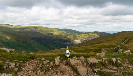 The Hm RescueGuard rescue helicopter, above Helvellyn Peak in the National Park Lake District 2022のeditorial素材