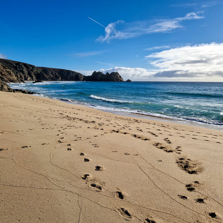 Sunny day in Porthcurno beach Cornwall, England February 2023.の写真素材