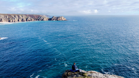 Sunny day in Porthcurno beach Cornwall, England February 2023.