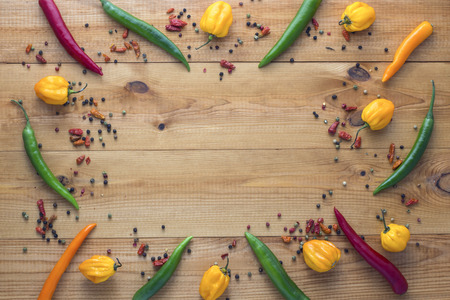 cayenne chilli peppers on wooden background
