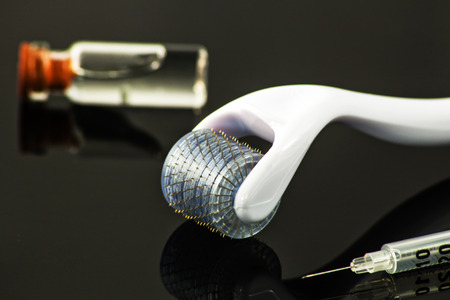 Dermaroller for medical micro needling therapy. Tool also known as: Derma roller, mesoroller, meso-roller, mesopen.の写真素材