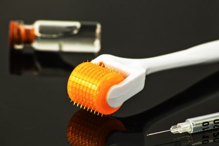 Dermaroller for medical micro needling therapy. Tool also known as: Derma roller, mesoroller, meso-roller, mesopen.の写真素材
