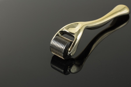 Dermaroller for medical micro needling therapy. Tool also known as: Derma roller, mesoroller, meso-roller, mesopen.の写真素材