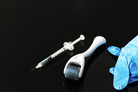 Dermaroller for medical micro needling therapy. Tool also known as: Derma roller, mesoroller, meso-roller, mesopen.の写真素材