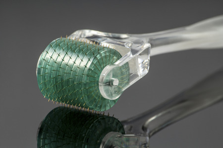 Dermaroller for medical micro needling therapy. Tool also known as: Derma roller, mesoroller, meso-roller, mesopen.の写真素材