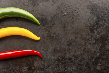 cayenne chilli peppers on rusty metal backgroundの写真素材