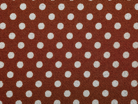 red background with white dotsの写真素材