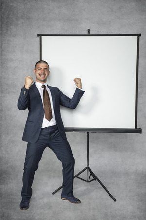 Young successful businessman blissful at workの写真素材
