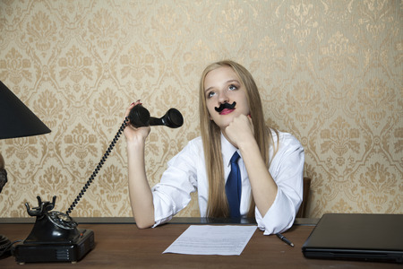 business woman is bored of talking on the phoneの写真素材