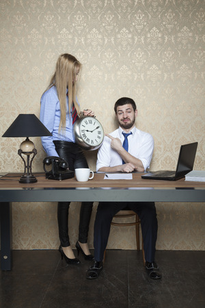 businessman pointing at the clockの写真素材