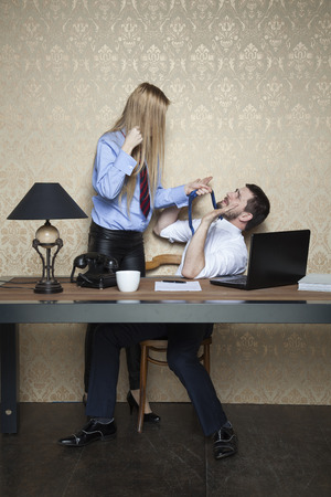 business woman threatens workerの写真素材