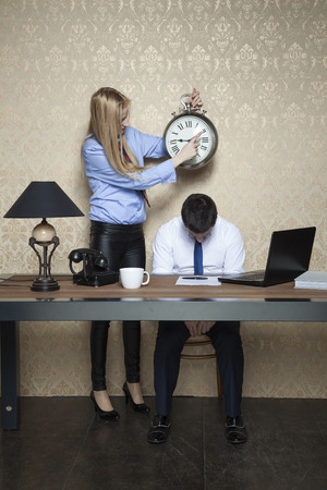 business woman shows at what time the work startsの写真素材