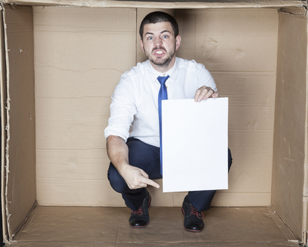 angry businessman pointing paperの写真素材