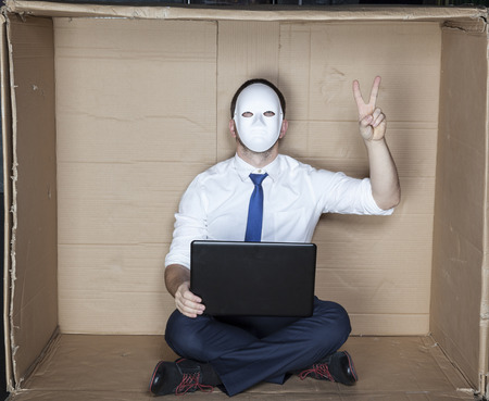 hacker executes a sign of peaceの写真素材