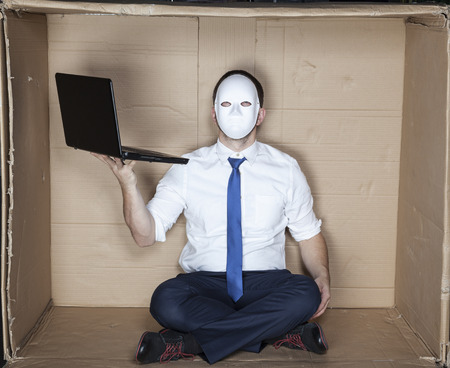 hacker wearing mask and tieの写真素材