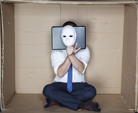 hacker behind computer and maskの写真素材