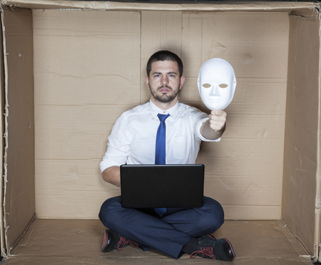 under the mask hides businessmanの写真素材
