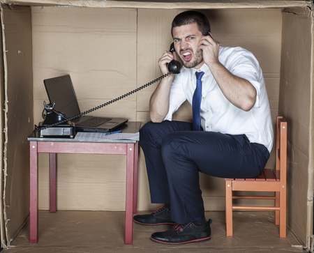businessman in the office talking on the phoneの写真素材