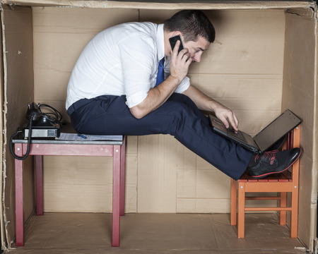 Businessman performs several tasks at onceの写真素材