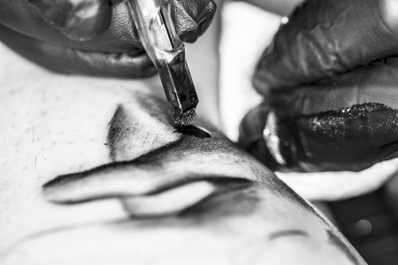 Close-up on a machine for tattooの写真素材