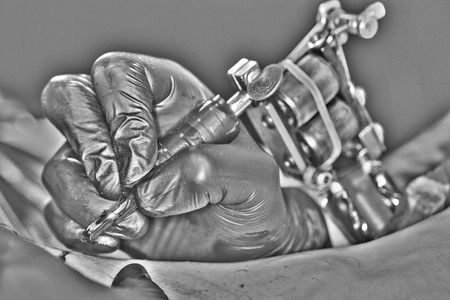 tattoo artist is working on a new projectの写真素材