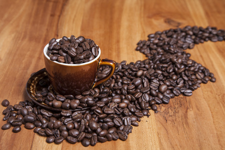 brown cup full of coffeeの写真素材