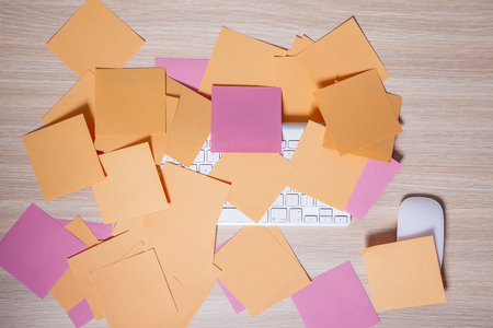 mouse and keyboard covered with sticky notesの写真素材