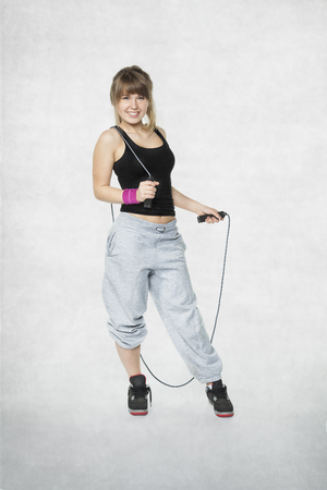 young girl holding a jump ropeの写真素材