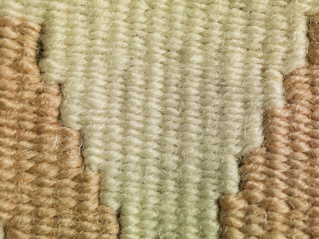 colored threads in the carpet
