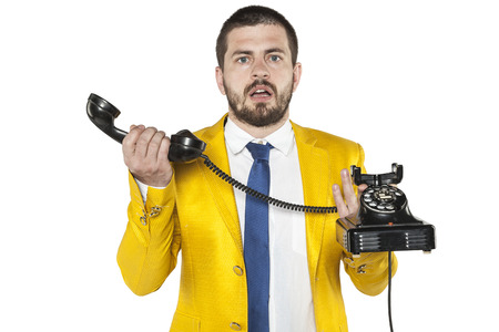 businessman does not know how the old phoneの写真素材
