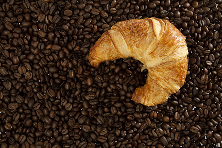 Coffee beans and croissantの写真素材