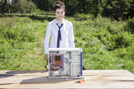 business woman and broken computer on the table