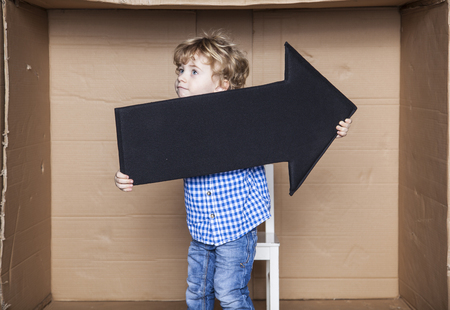 young businessman holding an arrow in his handsの写真素材