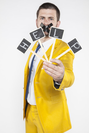 Unemployed businessman calling for helpの写真素材