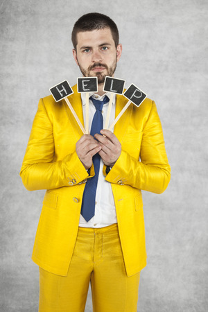 Portrait of businessman asking for helpの写真素材