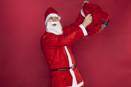 Santa Claus wonders that the bag is emptyの写真素材