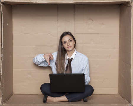 thumb down from a business woman for a stock market exchangeの写真素材