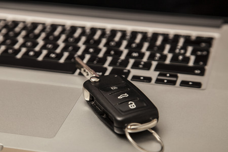 car key on the computer keyboard, close up