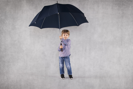 young insurance agent under umbrellas, an empty place for youの写真素材