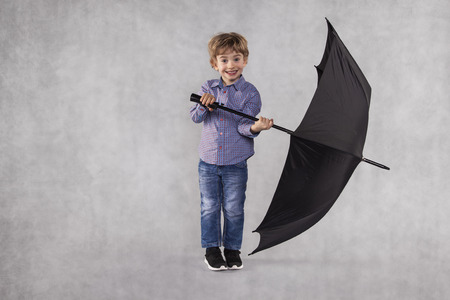 small businessman holding an umbrella in handsの写真素材
