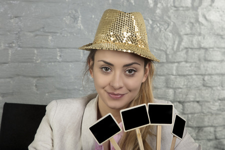 portrait of a business woman, holding a blank placard, copy space, idea of spending a new year in the companyの写真素材