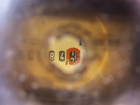 electricity meter seen through a hole