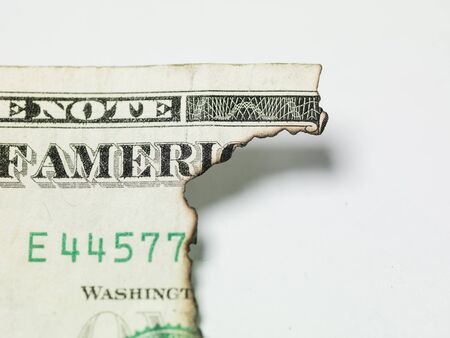 burnt one dollar bill on white backgroundの写真素材