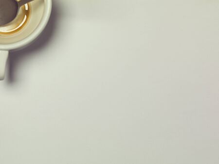 coffee cup, top view of the table and a blank sheet of paper, copy space