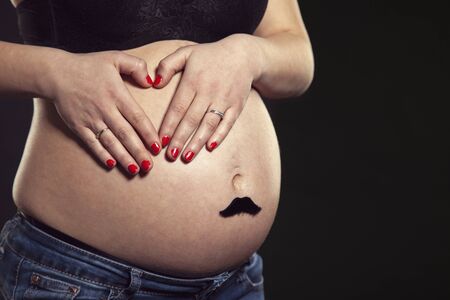 Unrecognizable woman with pregnancy tummy, future mother