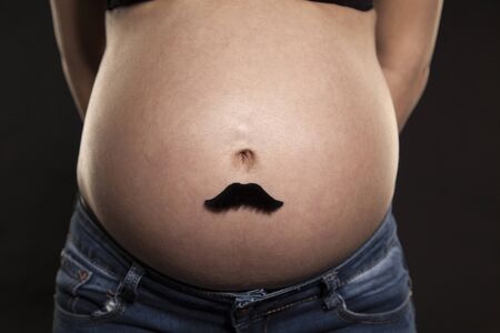 Unrecognizable woman with pregnancy tummy, future motherの写真素材