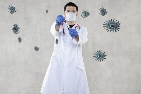doctor gives the ampoule for a blood sampleの写真素材
