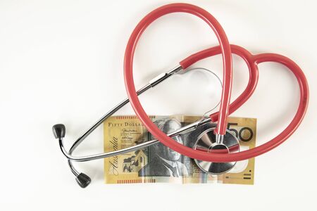 concept of healing Australian economy, stethoscope on the banknoteの写真素材
