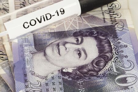 concept of the British pound dependent on the crisis caused by the pandemic coronavirusの写真素材